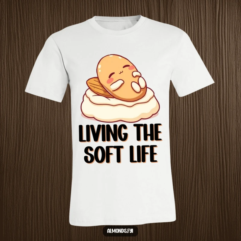 Funny t-shirt: A content almond character comfortably lounging on a fluffy dollop of cream.