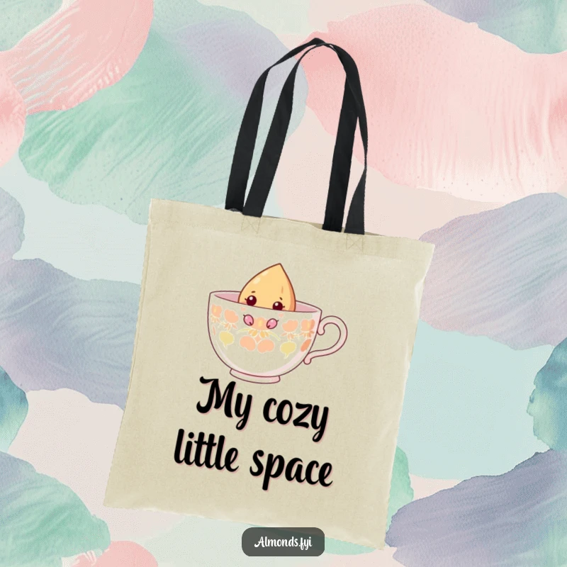 Funny tote bag depicting a curious almond character peeking from inside a giant teacup, ready for any outing.